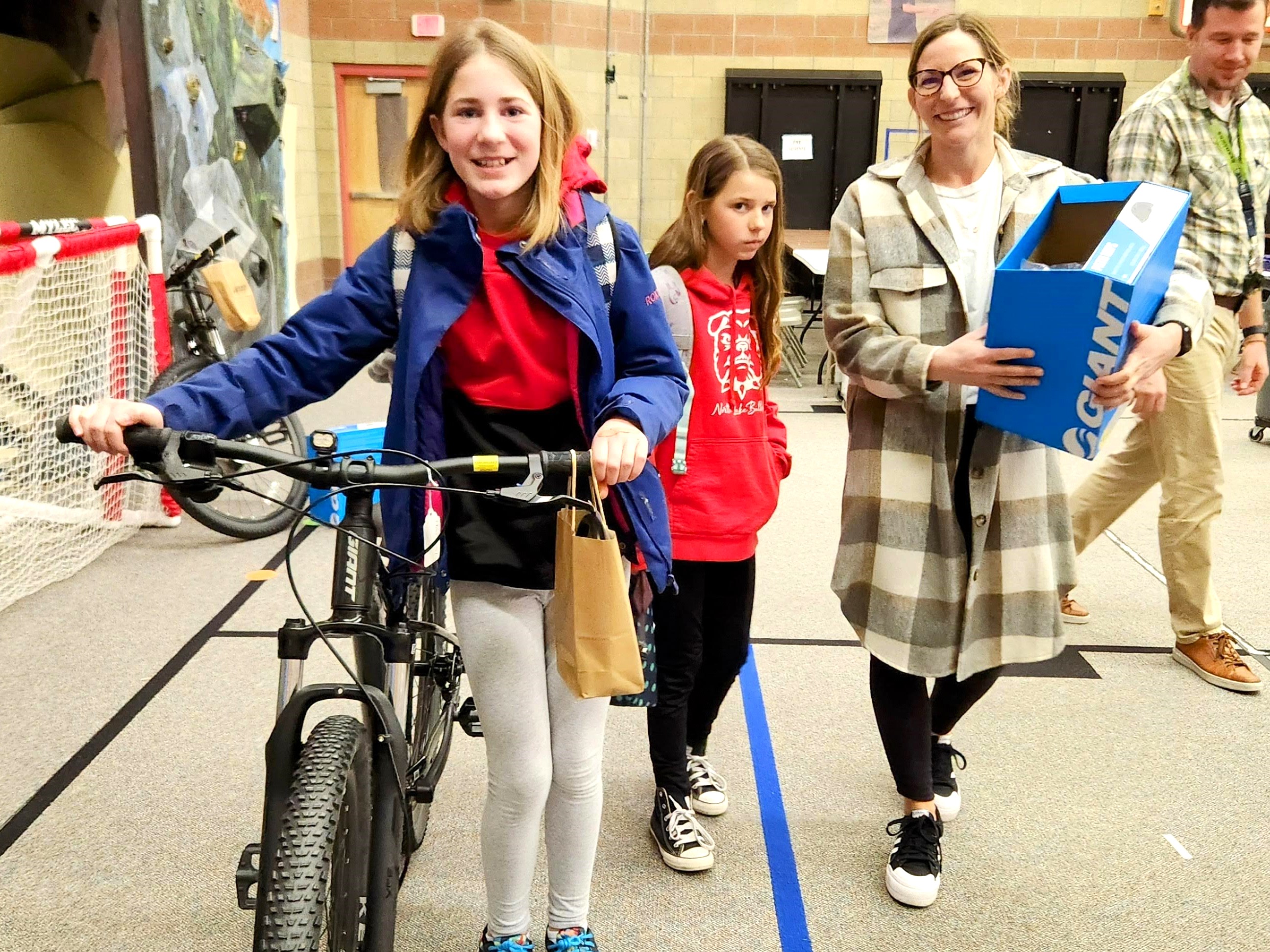 A happy Earn-a-Bike recipient